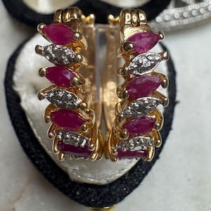 May include: A set of three ceramic mugs with a speckled, matte finish. Each mug features a different color: light blue, cream, and gray. The mugs have a simple, modern design and a comfortable handle.