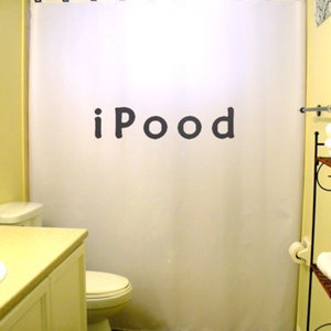 May include: A white shower curtain with the word "iPOOD" printed in black letters.