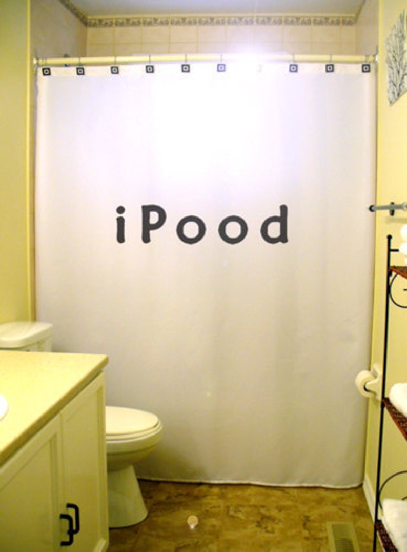 May include: A white shower curtain with the word "iPOOD" printed in black letters.