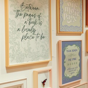wall art gallery mockup of the readers nook colorful poster designs with a grand millennial, maximalist cottage core vibe original designs by the readers nook. book lover art, bookish wall art, reading quote art, book club decor, book nook print, gift for readers, book themed print, cute book poster, bookish decor, reading room art, book quote print, quotes about books
