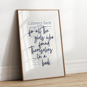 vintage-look library card print with for all the girls who found themselves in a book in navy blue text. visit the readers nook for more colorful bookish poster designs with a grand millennial, maximalist cottage core vibe original designs by the readers nook. book lover art, bookish wall art, reading quote art, book club decor, book nook print, gift for readers, book themed print, cute book poster, bookish decor, reading room art, book quote print, quotes about books