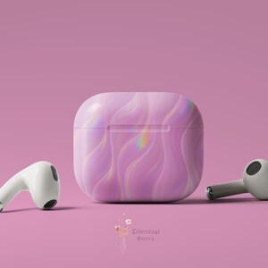 May include: A set of white wireless earbuds and a matching case. The case and the earbuds have a pink, iridescent, wavy pattern. The background is a solid pink color. The brand name "Zillennial Roots" is at the bottom.