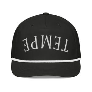 May include: Black baseball cap featuring the word "TEMPE" embroidered in white. The cap has a white rope detail along the brim and a curved visor. A stylish and practical accessory.