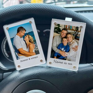 May include: Two clear acrylic photo frames with family photos. One frame has the text "Forever & always" and the other says "Home is us". The frames are held together with small magnets.
