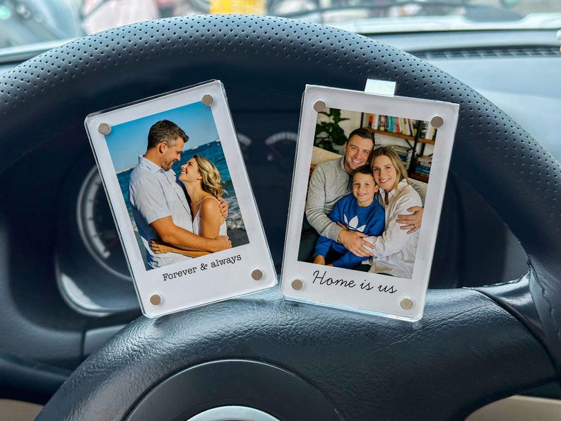 May include: Two clear acrylic photo frames with family photos. One frame has the text "Forever & always" and the other says "Home is us". The frames are held together with small magnets.