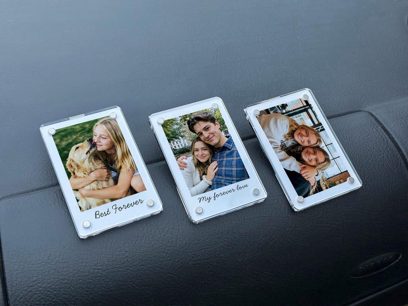 May include: Three clear acrylic photo frames with white borders. Each frame contains a photograph and a printed phrase: "Best Forever" and "My forever love". The photos show people and a dog.