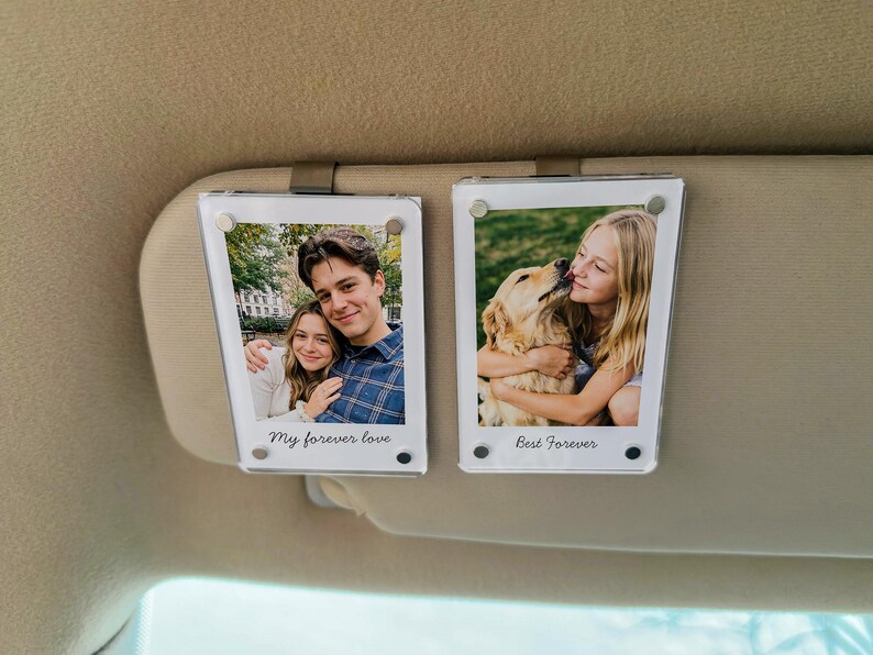May include: Two clear acrylic photo holders with metal clips, each displaying a photograph. One shows a couple with the text "My forever love." The other shows a girl with a dog, with the text "Best Forever."