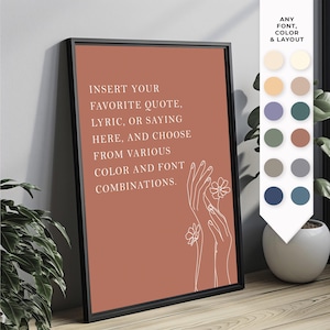 May include: Framed art print with a terracotta background and black frame. The print features white text that reads "INSERT YOUR FAVORITE QUOTE, LYRIC, OR SAYING HERE, AND CHOOSE FROM VARIOUS COLOR AND FONT COMBINATIONS." White line art of hands and flowers is also included.