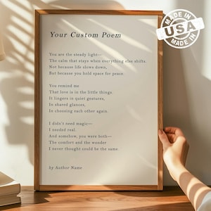 May include: A framed print with a wooden frame, displaying a custom poem in black text on a white background. The poem begins with "You are the steady light-" and ends with "I never thought could be the same." A "Made in USA" sticker is in the upper right corner.
