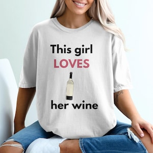 This girl loves her wine shirt, Funny wine lover t-shirt, Wine humor graphic tee, Gift for wine enthusiasts, Wine drinking top