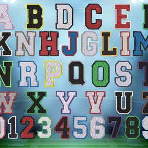 May include: Embroidered varsity letters and numbers in various colors, including red, green, and blue. The letters are in a classic collegiate font, with a white outline. The background is a gradient of blue and green.