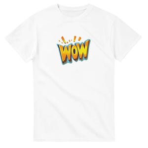 May include: White t-shirt with the word "WOW" in a comic book style. The word is yellow with a blue outline and orange accents, creating a bold design. A fun and eye-catching graphic.