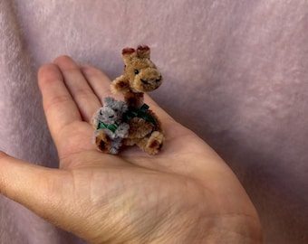 Tiny cute handmade giraffe holding his teeny hippo friend. 1.5inches sitting Cute gift.