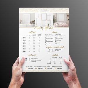 May include: A white pricing guide with gold text for a photography studio. The guide lists prices for wall art, albums, small prints, and digital files. The prices are listed in US dollars.