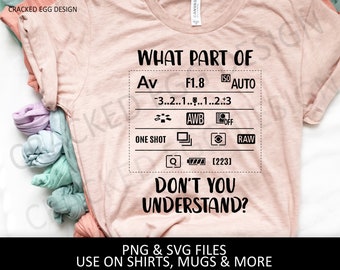 May include: A pink t-shirt with a black graphic that says "What part of Av F1.8 ISO AUTO 3..2..1.....1..2..3 ONE SHOT AWB OFF RAW [223] DON'T YOU UNDERSTAND?"  PNG & SVG FILES USE ON SHIRTS, MUGS & MORE"
