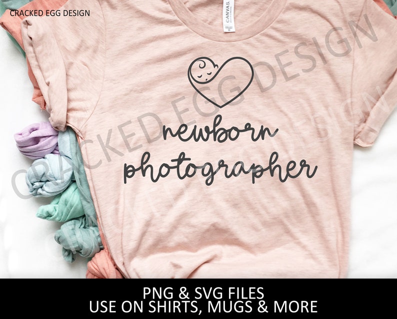 May include: A pink t-shirt with the text "newborn photographer" and a heart with a baby inside. The text "CRACKED EGG DESIGN" is at the top of the image. The text "PNG & SVG FILES USE ON SHIRTS, MUGS & MORE" is at the bottom of the image.