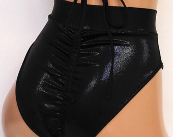 May include: Black high-waisted swimsuit bottoms with a shiny, wet look finish. The bottoms have a high cut leg and a tie at the back.