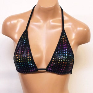 May include: Black halter top with a rainbow iridescent polka dot pattern.