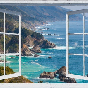 May include: A white window frame with a view of a rocky coastline and blue ocean. The window is open and the view is framed by the window panes.