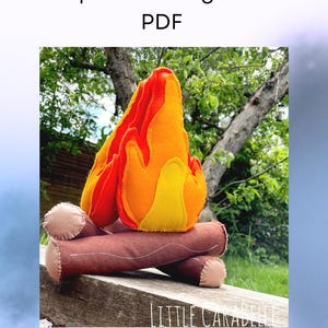 May include: A felt campfire sewing pattern. The image shows a felt campfire with orange, yellow, and red flames atop brown felt logs. The text "Campfire Sewing Pattern PDF" is at the top. The words "Pattern & Sewing Instructions" are at the bottom.