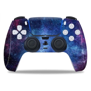 May include: A wireless game controller with a galaxy-themed design. The controller features a blue, purple, and white nebula pattern. It has black joysticks, white buttons, and a PlayStation logo.