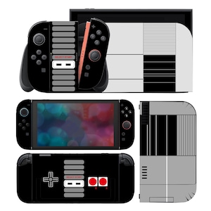 May include: A black and gray Nintendo Switch console skin with a retro video game design. The skin features a controller design with the words "SELECT START" and red and white buttons. The console is shown in multiple views.