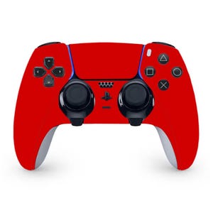 May include: A red PlayStation 5 DualSense wireless controller with black buttons and a black PlayStation logo.