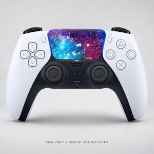 May include: A white and black video game controller featuring a vibrant galaxy-themed skin on the central touchpad, displaying shades of blue, purple, and pink with star-like speckles. The text SKIN ONLY • DEVICE NOT INCLUDED is visible below.