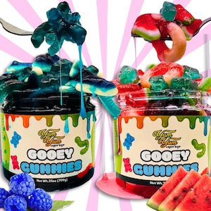 May include: Two jars of "Gooey Gummies" candy, one blue and one red, with a variety of gummy shapes. The jars have a label with the text "Yum Yum Candy Shop" and "Gooey Gummies". The net weight is 25oz (709g).
