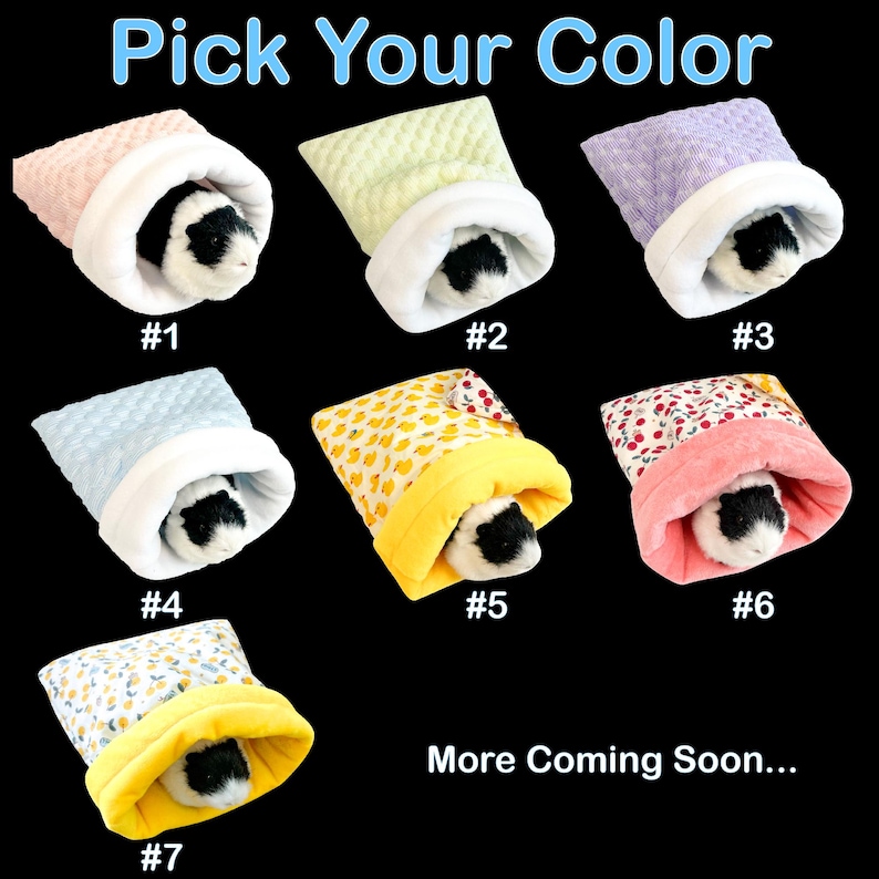 May include: A selection of seven colorful guinea pig sleeping bags, each with a different pattern and color, including pink, green, purple, blue, yellow, and floral designs. Each bag has a white interior and a guinea pig peeking out. Text reads "Pick Your Color."
