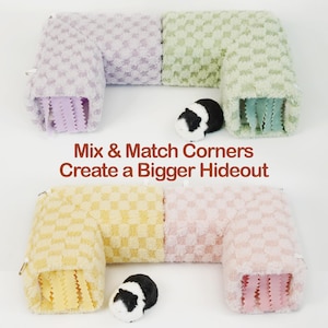May include: A product photo shows two L-shaped pet hideouts in various colors: lavender, green, yellow, and pink. Each hideout has a checkered pattern and a soft, plush texture. The text "Mix & Match Corners Create a Bigger Hideout" is displayed.