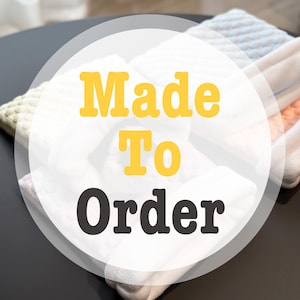 May include: A stack of folded knitted items in various colors, including white, light blue, and orange. The image has the text "Made To Order" in yellow and black.