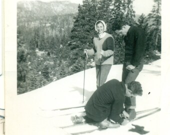 1940s Ski Boot Binding Adjustment Help Man on Ground Vintage Black White Photo Photograph