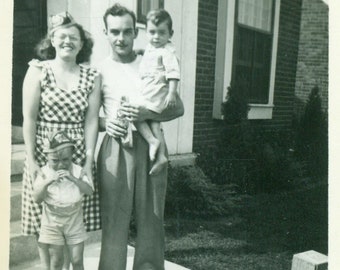 1948 Baby Boomer Family Red Wagon Funny Hats Plaid Sun Dress Crying Boy 1940s Summer Vintage Black and White Vintage Photo Photograph