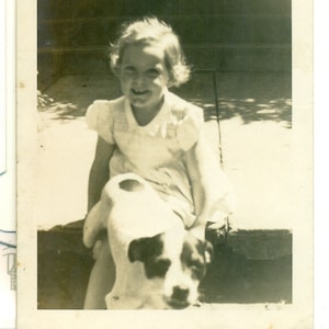 Puppy Jumping Toward Camera Girls Lap 1940s Photo Black White Photograph