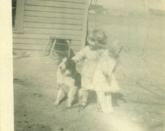 Toddler Girl Holding Giant Doll Petting Dog On Farm 1910s Antique Photo Black White Photograph