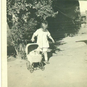 1920s Girl Pushing Doll in Wicker Toy Stroller Outside 20s Vintage Photo Black White Photograph