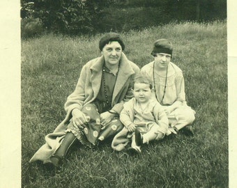 1930s Family Grandmother Girl Baby Sitting Outside in Grass Headband Dress 30s Vintage Black and White Photo Photograph