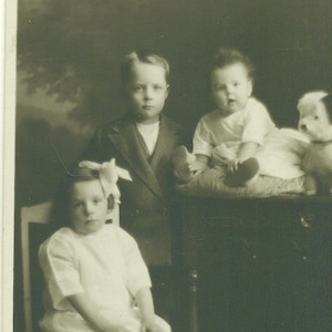 Antique RPPC Baby Girl Toy Dog Stuffed Animal Brother Sister 1920s Portrait Sepia Photo Photograph