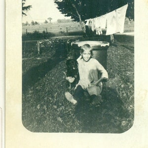 Girl Hugging Black Dog On Laundry Day Wash Hanging Line 1910s RPPC Real Photo Postcard Photograph