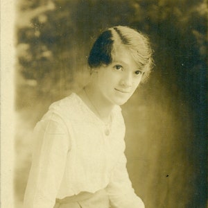 1915 Beautiful Young Woman Sitting on Desk Antique RPPC Real Photo Postcard Photograph Black White Photo