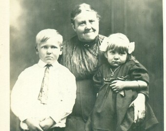 Shy Little Girl Sitting in Grandma's Lap Brother Boy Old Woman Portrait Antique RPPC Real Photo Postcard