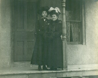 Winter Women Standing On Porch Coats Fur Muff Big Hats 1900s RPPC Real Photo Postcard Vintage Photograph