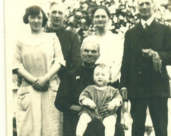 1920s Angry Grandmother Holding Baby Frowning Woman Family Photo 20s Vintage Photograph Black White Photo