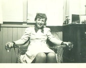 1950s Woman Holding Drinking Glass in Each Hand Sitting in Wicker Chair Party 50s Vintage Photograph Black White Photo