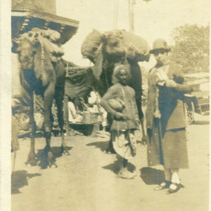 Camels With Packs Middle Eastern Man Proper European Woman on Vacation RPPC Real Photo Postcard Vintage Photograph