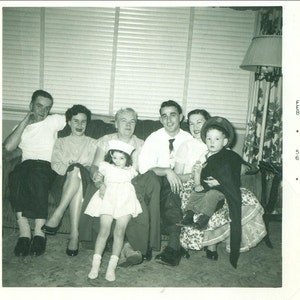 1956 Family Girl in Dress Sailor Hat Little Boy Wearing Dad&#39;s Army Hat Black and White Vintage Photo Photograph