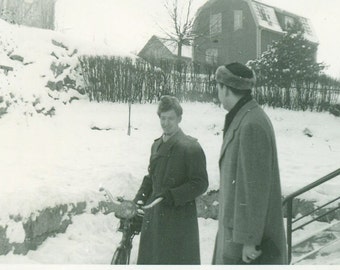 Bicycling Through the Snow Man in Fur Cap Holding Bicycle or Motor Bike Vintage Black White Photo Photograph