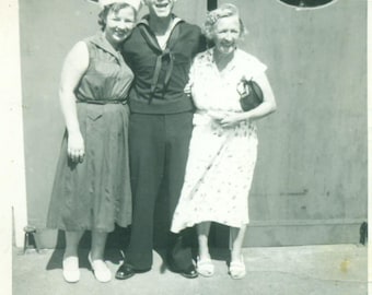 1954 Navy Sailor and Wife in Matching White Hats Uniform Standing With His Mother Visit 1950s Vintage Black And White Photo Photograph