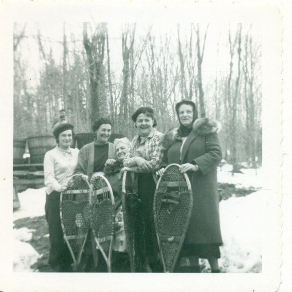 1950s Women Holding Snowshoes Short Grandma In Center Winter Vintage Black White Photo Photograph